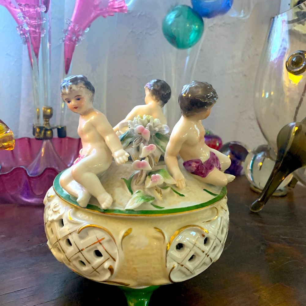 Vintage porcelain lidded jar with cherubs